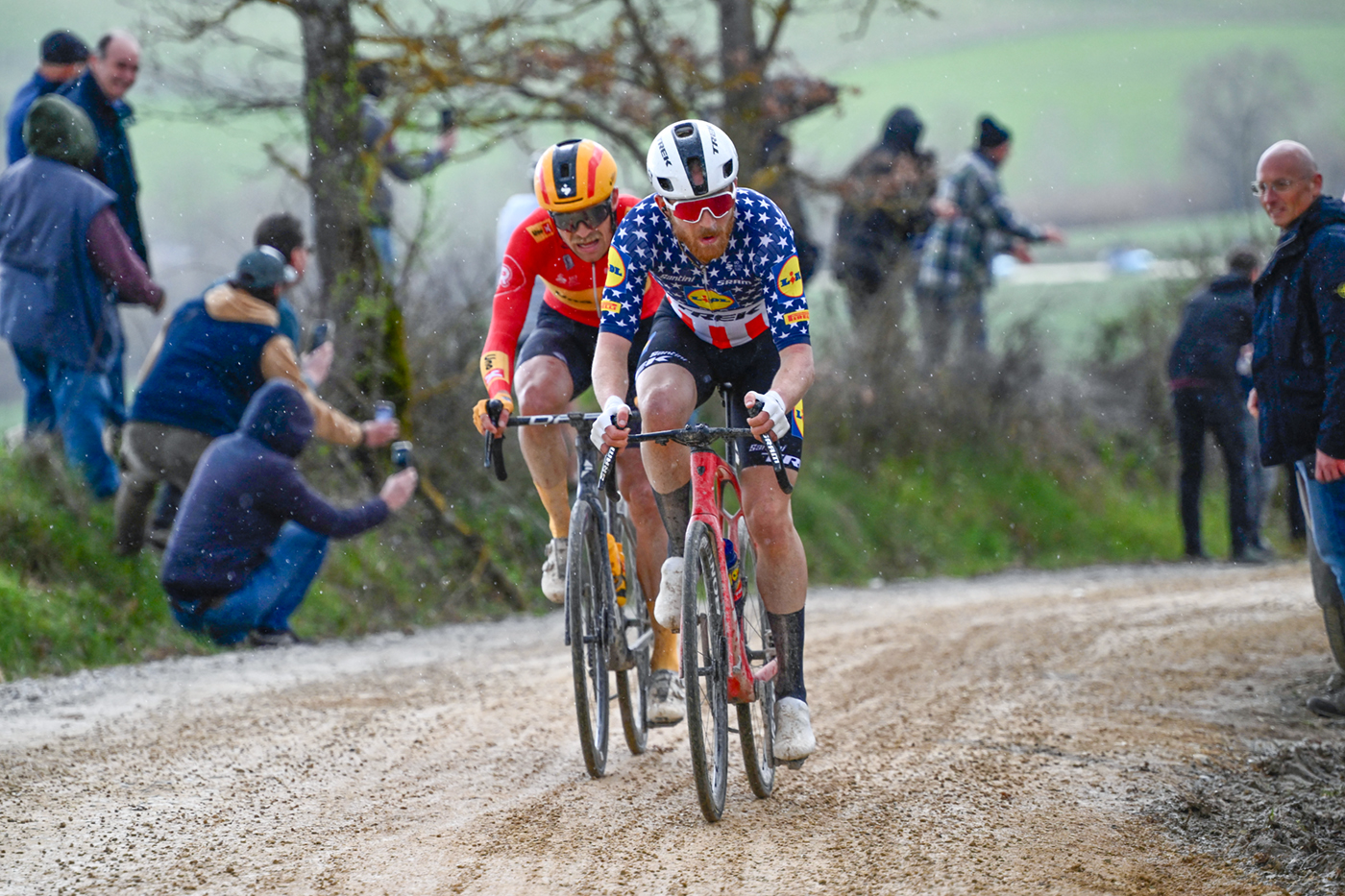 US Quinn Simmons (R), team Lidl-Trek, and Denmark's Magnus Cort, team Uno-X Mobility, compete during the 18th one-day classic 'Strade Bianche' (White Roads) cycling race between Siena and Siena, Tuscany, on March 2, 2024. (Photo by Marco BERTORELLO / AFP) (Photo by MARCO BERTORELLO/AFP via Getty Images)