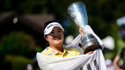 Haeran Ryu holds the Evian Championship trophy
