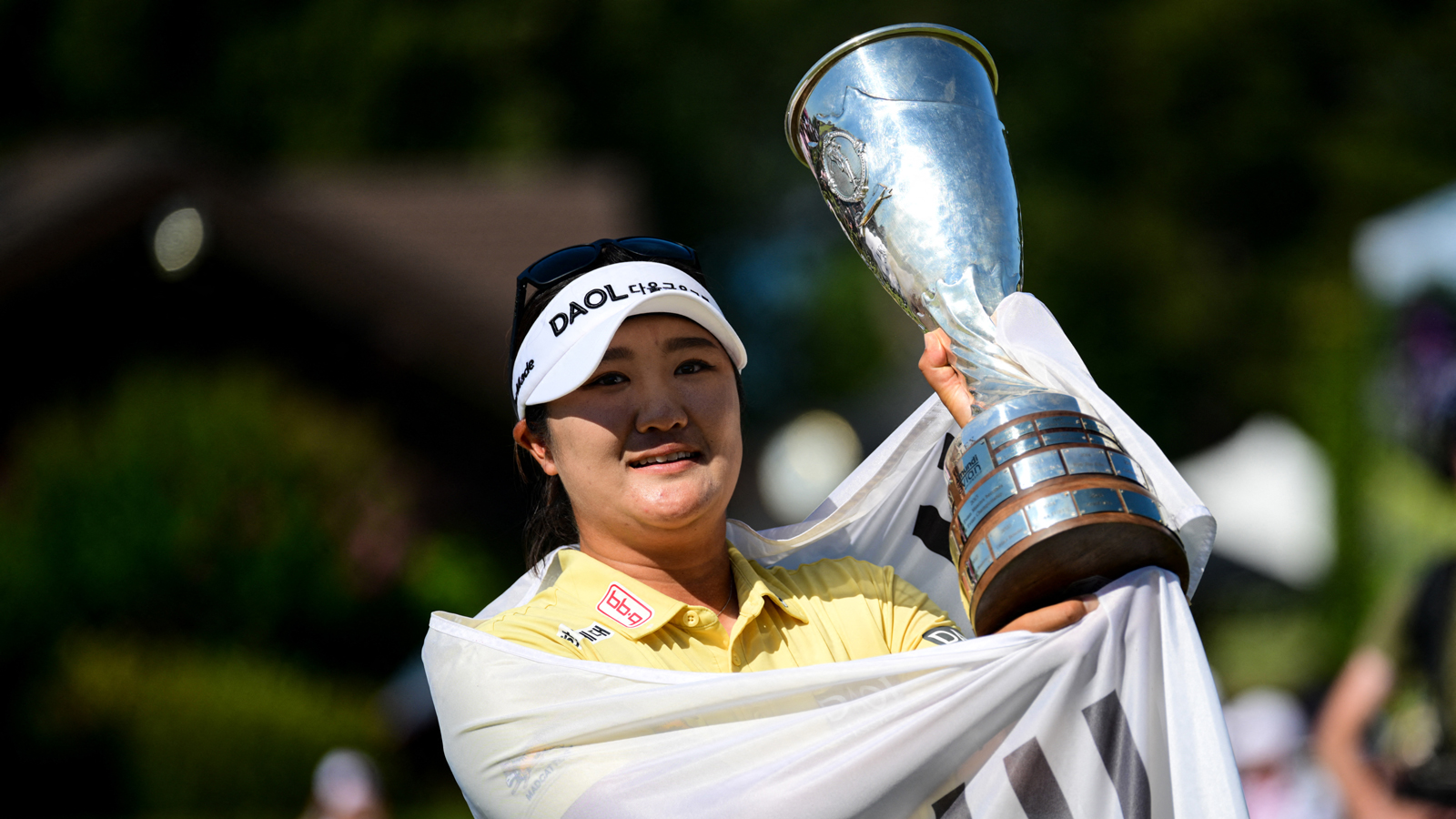 Haeran Ryu holds the Evian Championship trophy