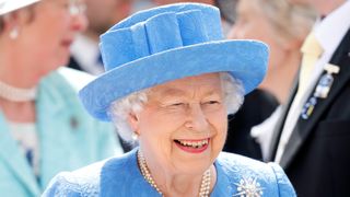 Queen Elizabeth II attends 'Derby Day' of the Investec Derby Festival