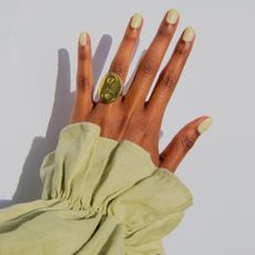 Photo of lime green nail polish on hand