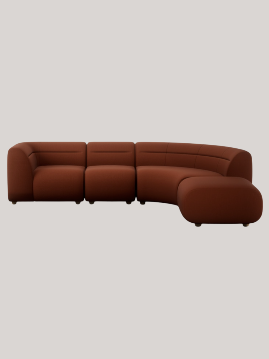 A curved rust-colored chaise sofa from Heal's