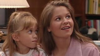 One of the Olsen twins as Michelle and Candace Cameron Bure as DJ on a Season 7 episode of Full House.