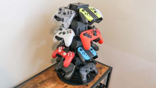 A spinning controller stand holding several different controllers