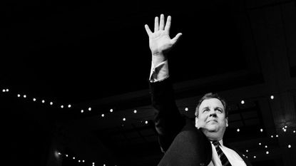 A black and white photo of Chris Christie waving
