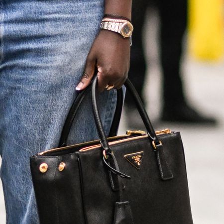 Nikki Ogunnaike wearing a watch and a Prada bag