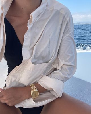 Woman wearing a Rolex Datejust watch.