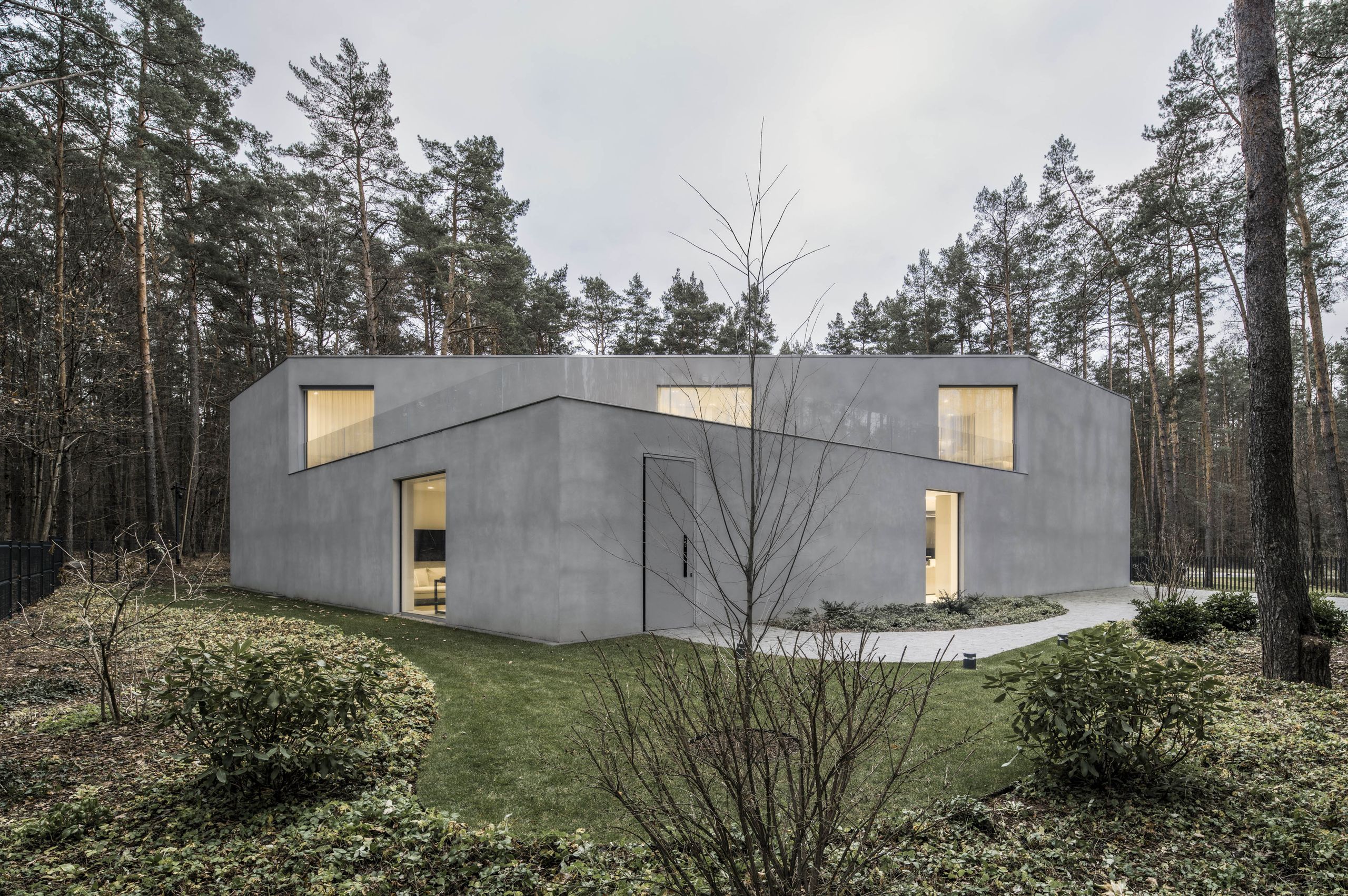 A Lithuanian house cuts through the landscape with its crisp, contemporary, triangular figure