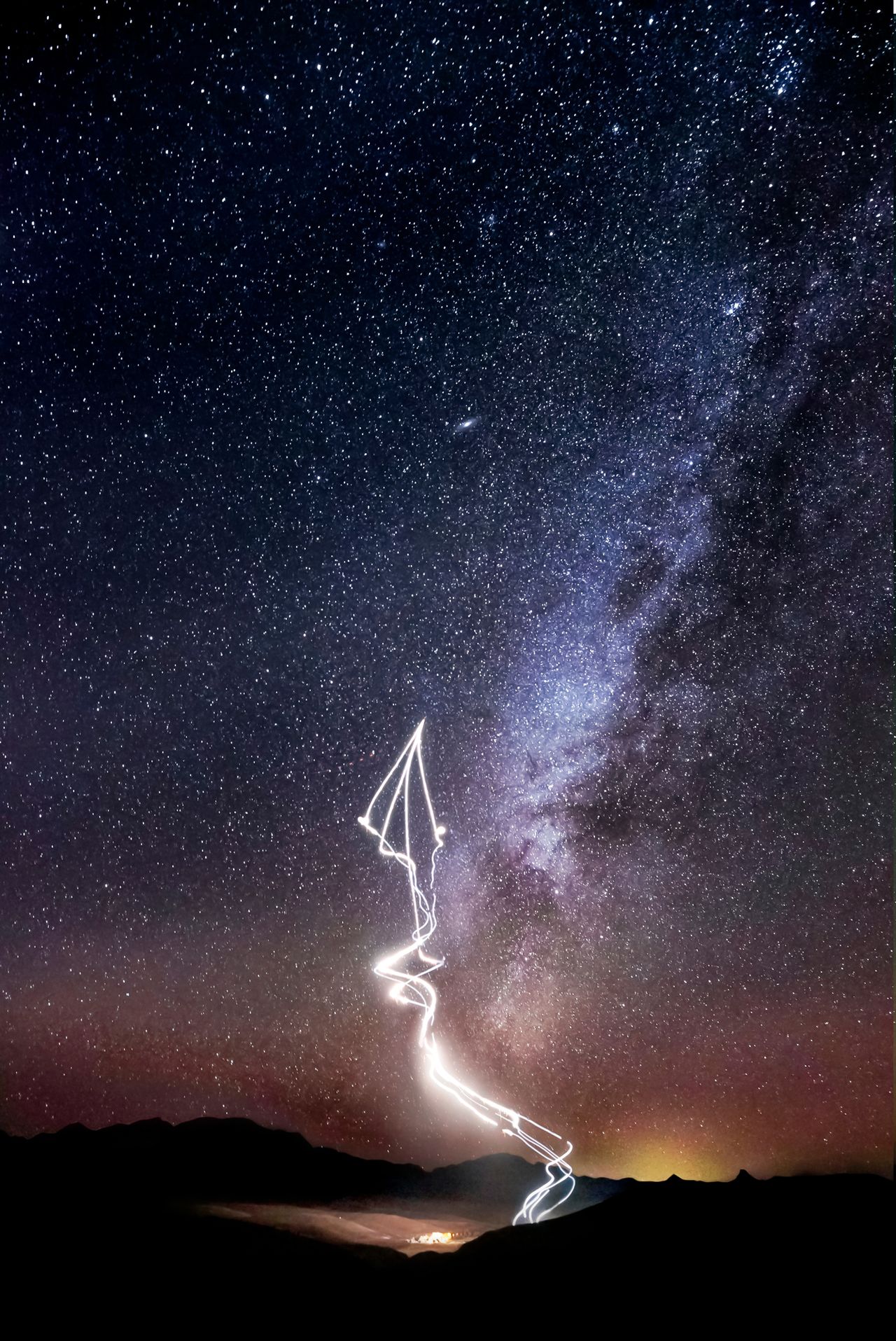 The Red Bull Air Force skydiving team paint the night sky in dazzling "Marfa lights" near Marfa, Texas in these amazing images by photographer Dustin Snipes to celebrate the night sky for the winter solstice 2020. The jump took place in November 2020.