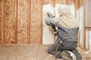 spray foam insulation being installed in wall