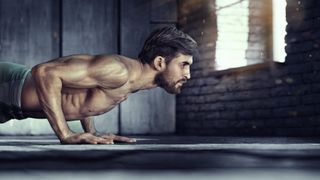 a photo of a man doing a push up 