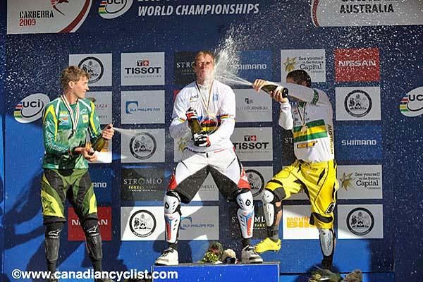 Mick Hannah (Australia) treats Steve Peat (Great Britain) to a champagne shower