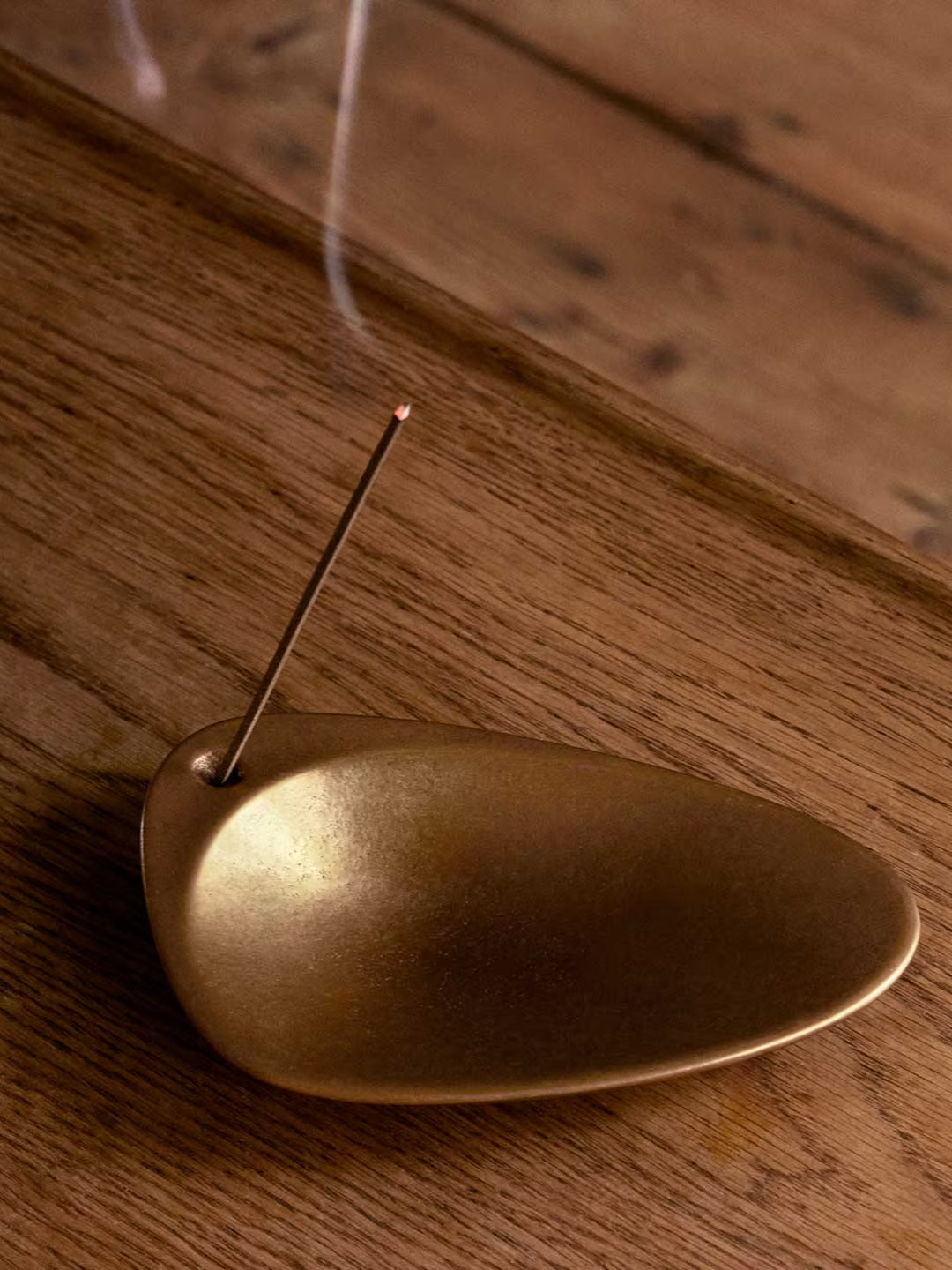A brass incense holder
