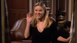 Reese Witherspoon smirking at her sister in Friends