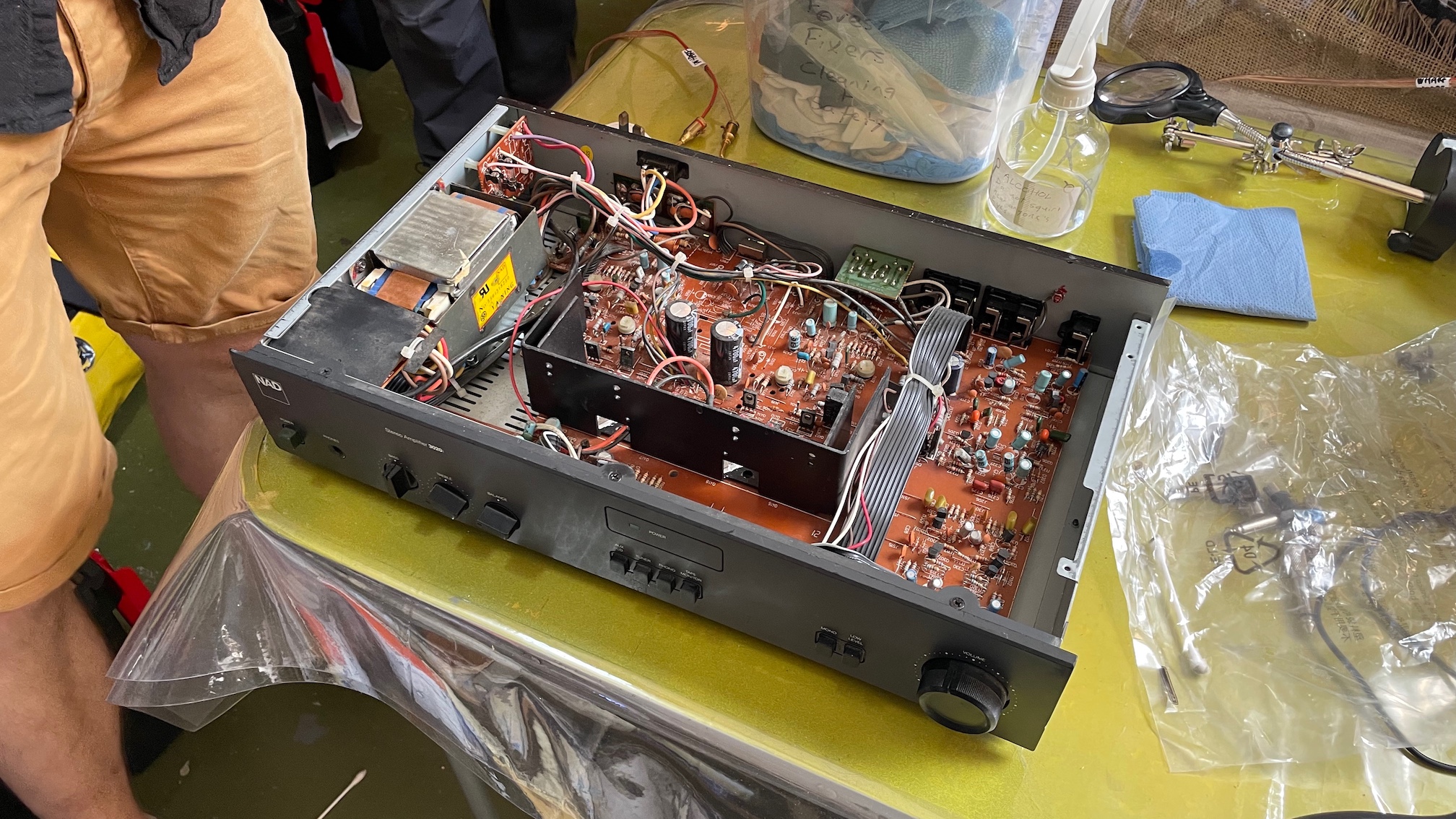 A NAD 3020i amp being taken apart with its internal components exposed.
