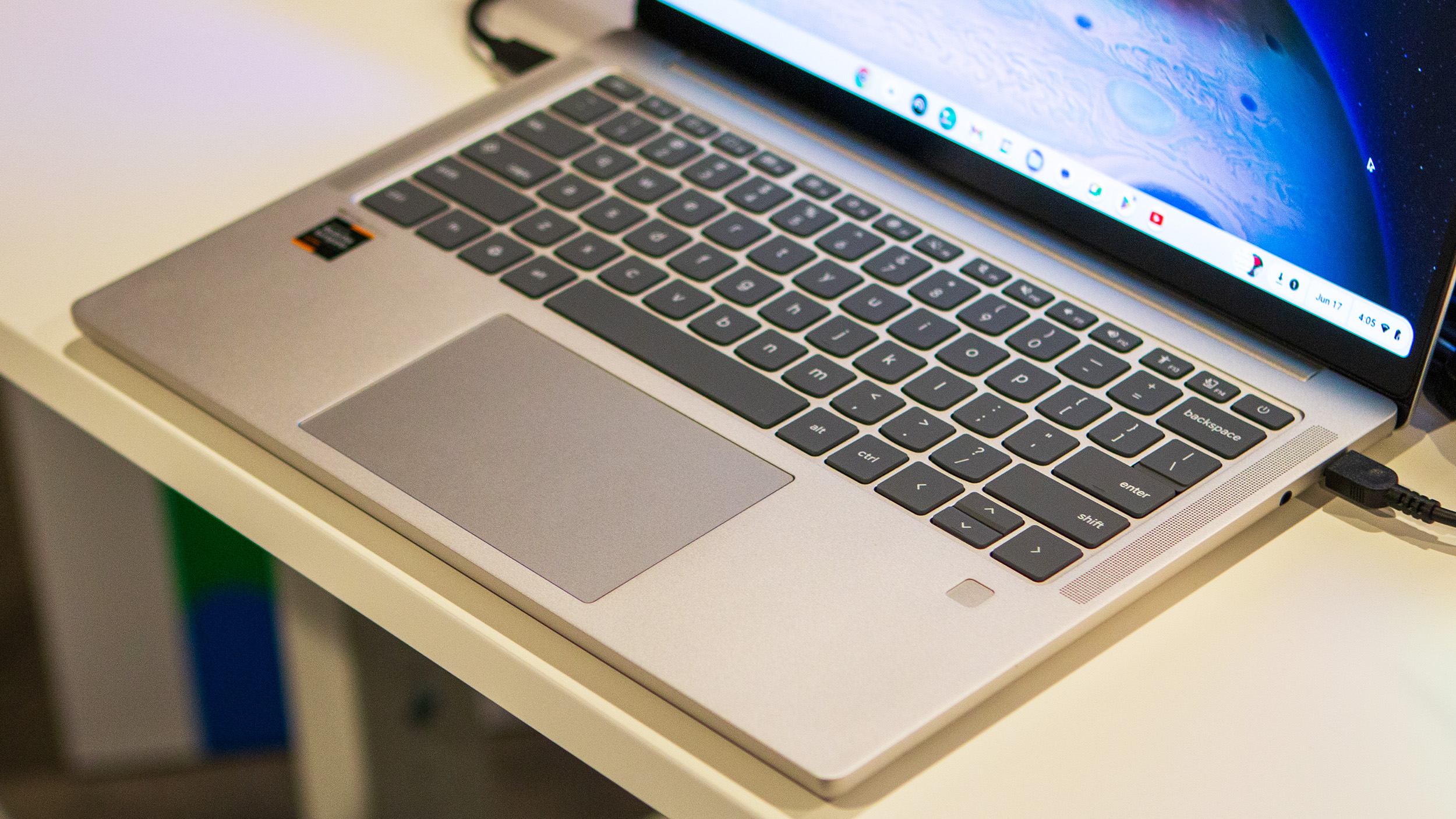 Lenovo Chromebook Plus 14 close-up on keyboard, trackpad, and fingerprint scanner
