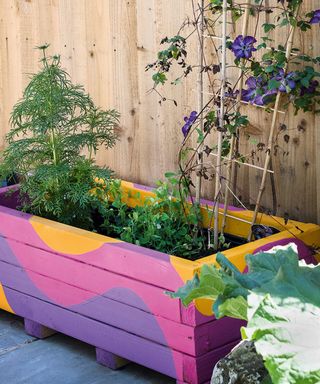 painted planter on decking