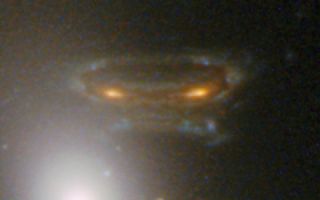 Gravitationally Lensed Image of Distant Galaxy in Abell 68