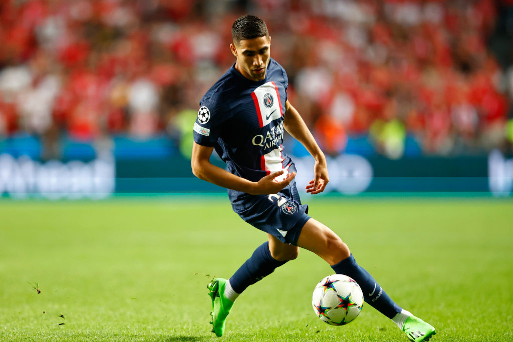 Achraf Hakimi of Paris Saint-Germain controls the ball during the UEFA Champions League group H match between SL Benfica and Paris Saint-Germain at Estadio do Sport Lisboa e Benfica on October 5, 2022 in Lisbon, Portugal.