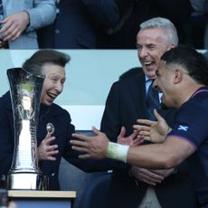 Princess Anne pretending to hug a rugby player