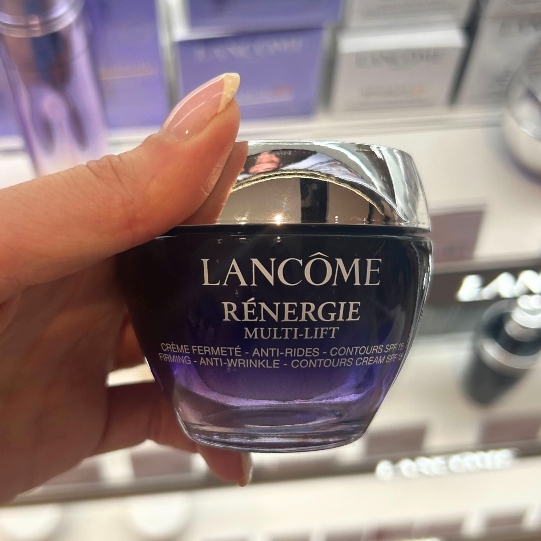 Hand holding tub of Lancome Re&amp;#769;nergie Multi-Lift Night 50ml in World Duty Free
