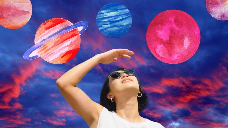 woman looking at planets, meant to depict what planet is in retrograde
