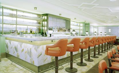 Green bar with orange leather bar stools