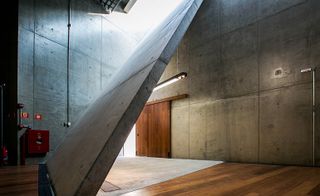 Image of one of the 'folds', a concrete slab, wall to floor angled for acoustics