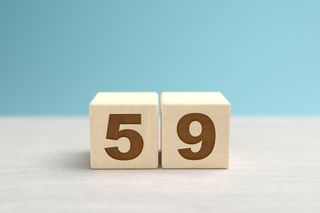 Wooden toy blocks forming the number 59.