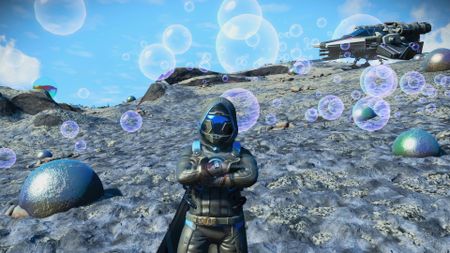 Someone posing on an alien planet in No Man's Sky version 5.0