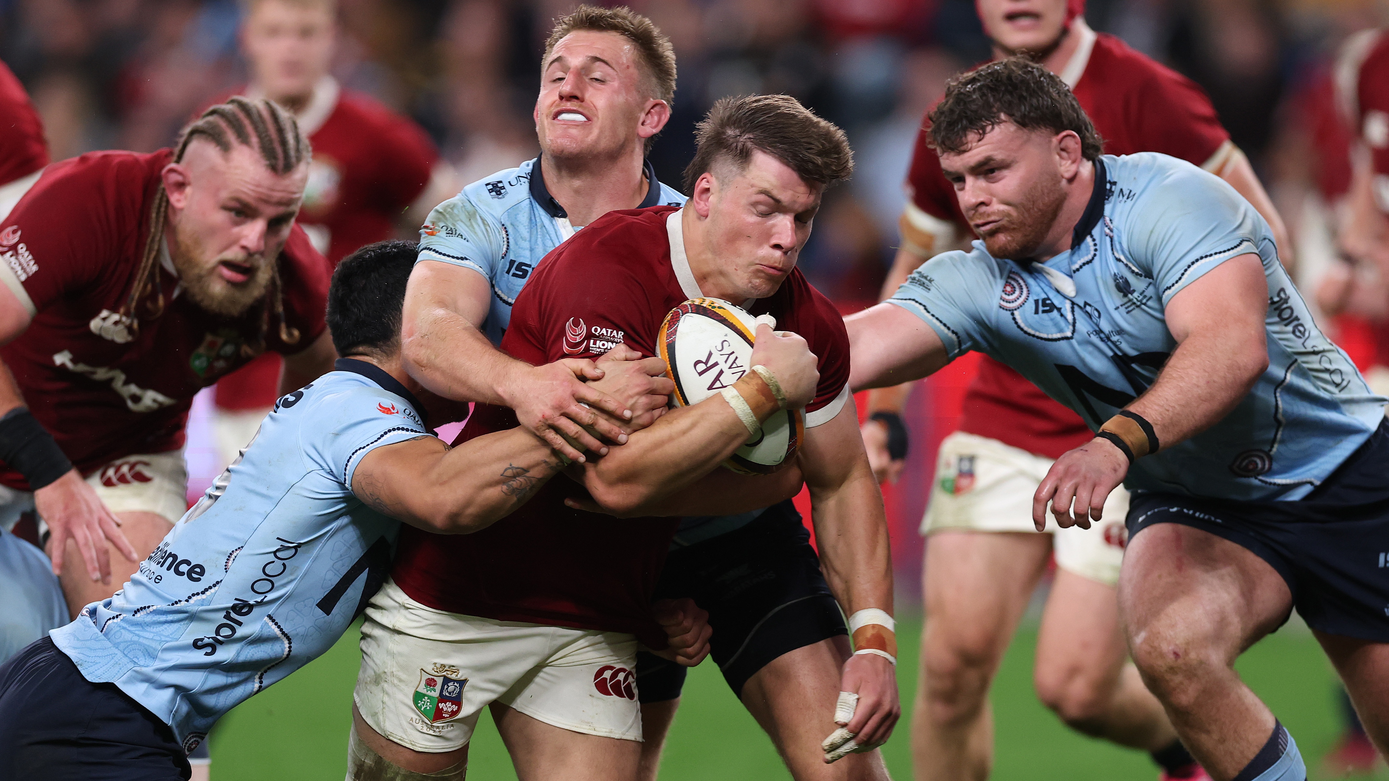 Huw Jones of the British & Irish Lions goes past the Waratah's defence to score his and the Lions second try during the tour match between NSW Waratahs and British & Irish Lions at Allianz Stadium on July 05, 2025 in Sydney, Australia.