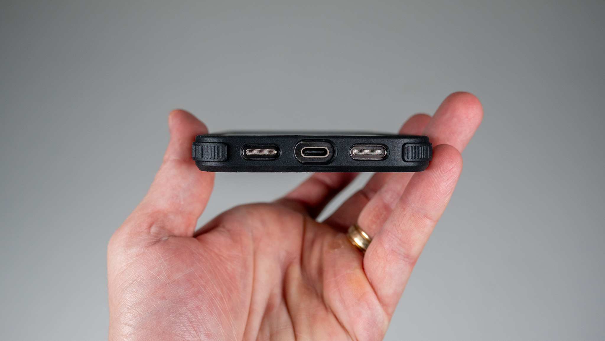 A Dbrand Ghost 2.0 case on a white Google Pixel 10 Pro XL