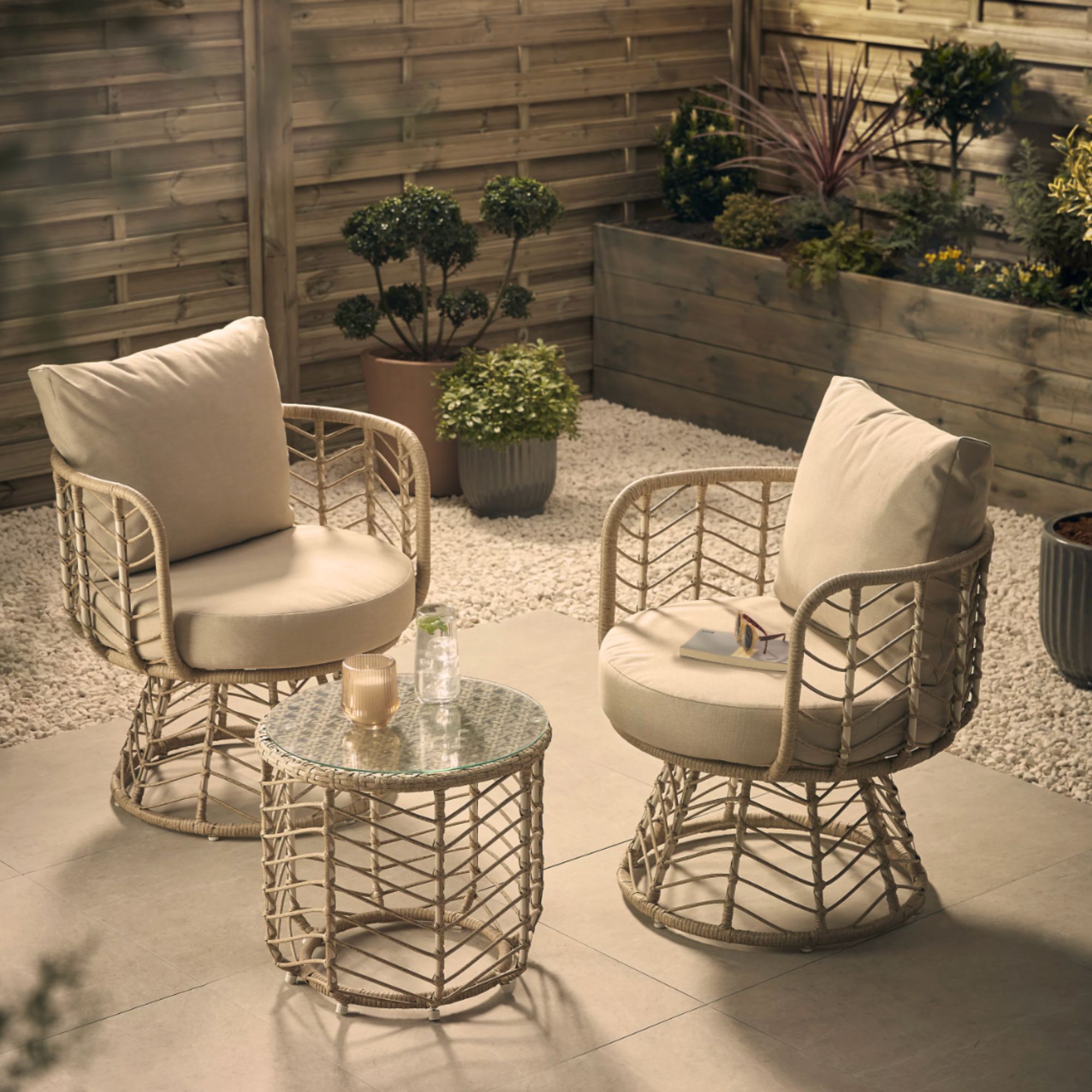 B&amp;amp;Q, GoodHome Omalos Beige Metal 2 seater Bistro set in garden with candle and drink on table