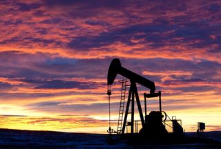 A silhouette of a pumpjack for oil drilling.