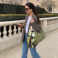 A French woman in jeans and a blazer