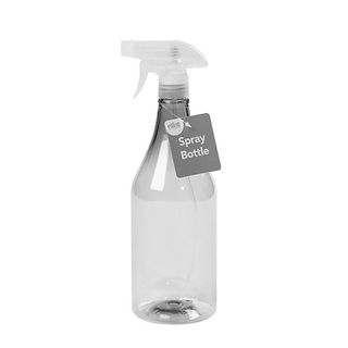 grey spray bottle with a product label attached on a white background