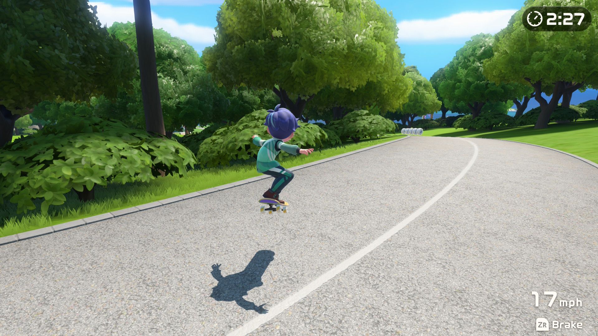 A screenshot showing a person skateboarding on the road in Nintendo Switch Sports Resort