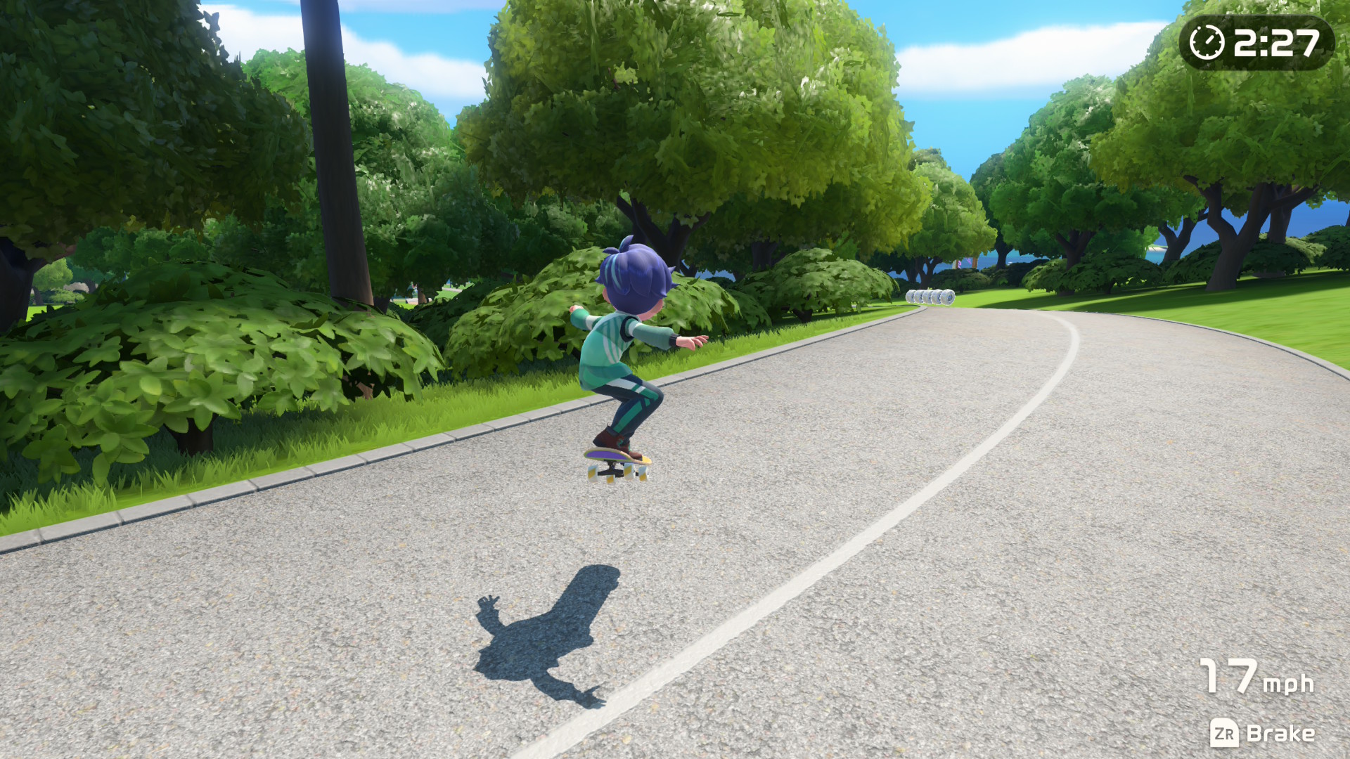 A screenshot showing a person skateboarding on the road in Nintendo Switch Sports Resort