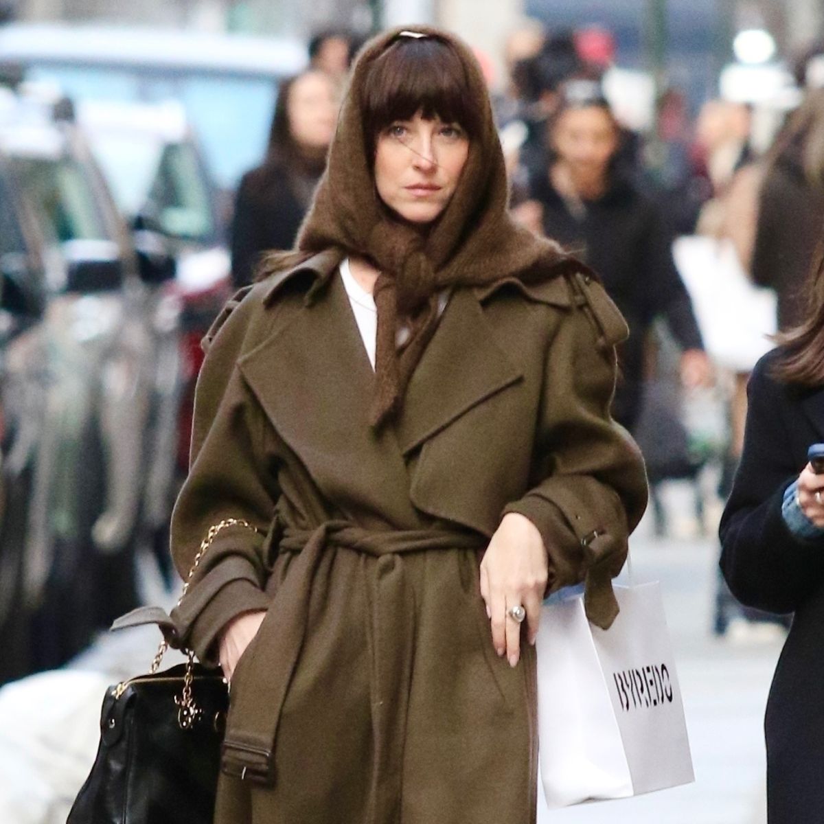 dakota johnson in new york wearing a triangle scarf