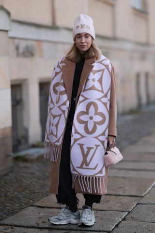 Sonia Lyson in Louis Vuitton pink and tan scarf GettyImages-1850394406