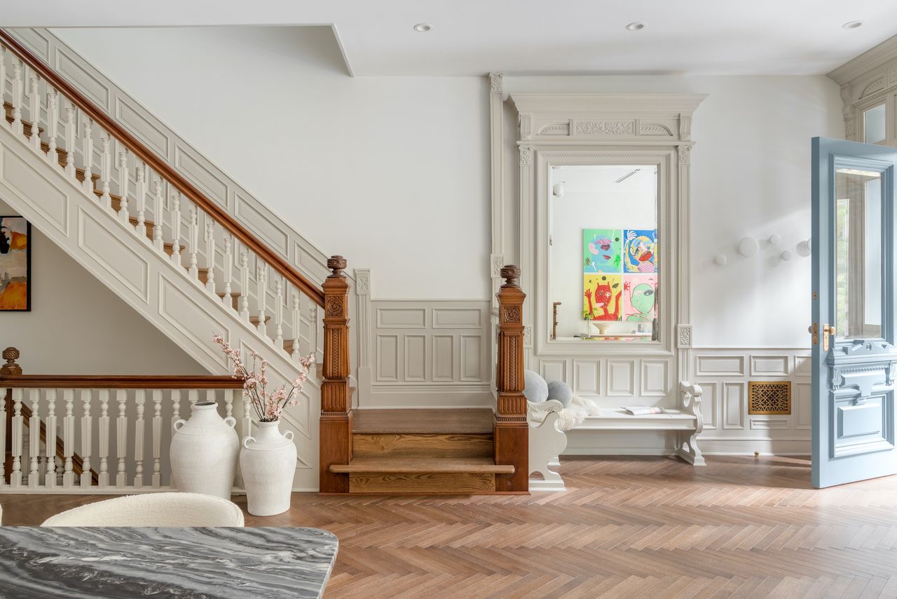 The staircase in a Brooklyn brownstone with a new neutral palette