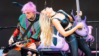 Machine Gun Kelly and Sophie Lloyd perform during 2022 Bonnaroo Music & Arts Festival on June 19, 2022 in Manchester, Tennessee.