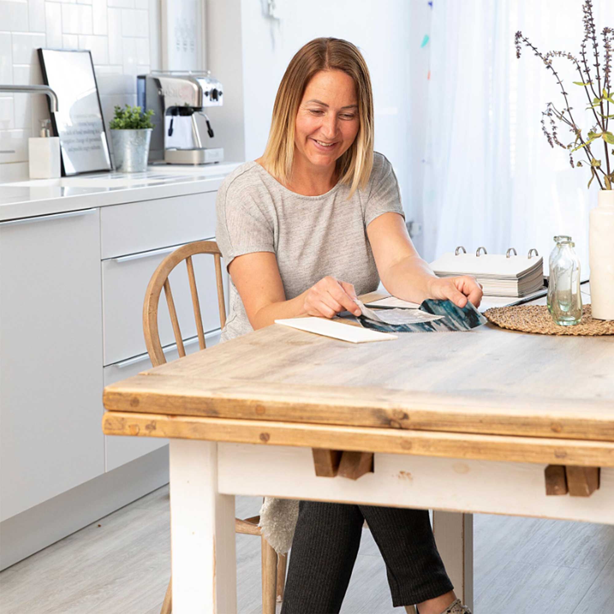 Lindsay Goth an interior designer sat at her kitchen table 