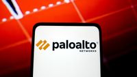 The Palo Alto Networks logo on a phone, against a red screen background.