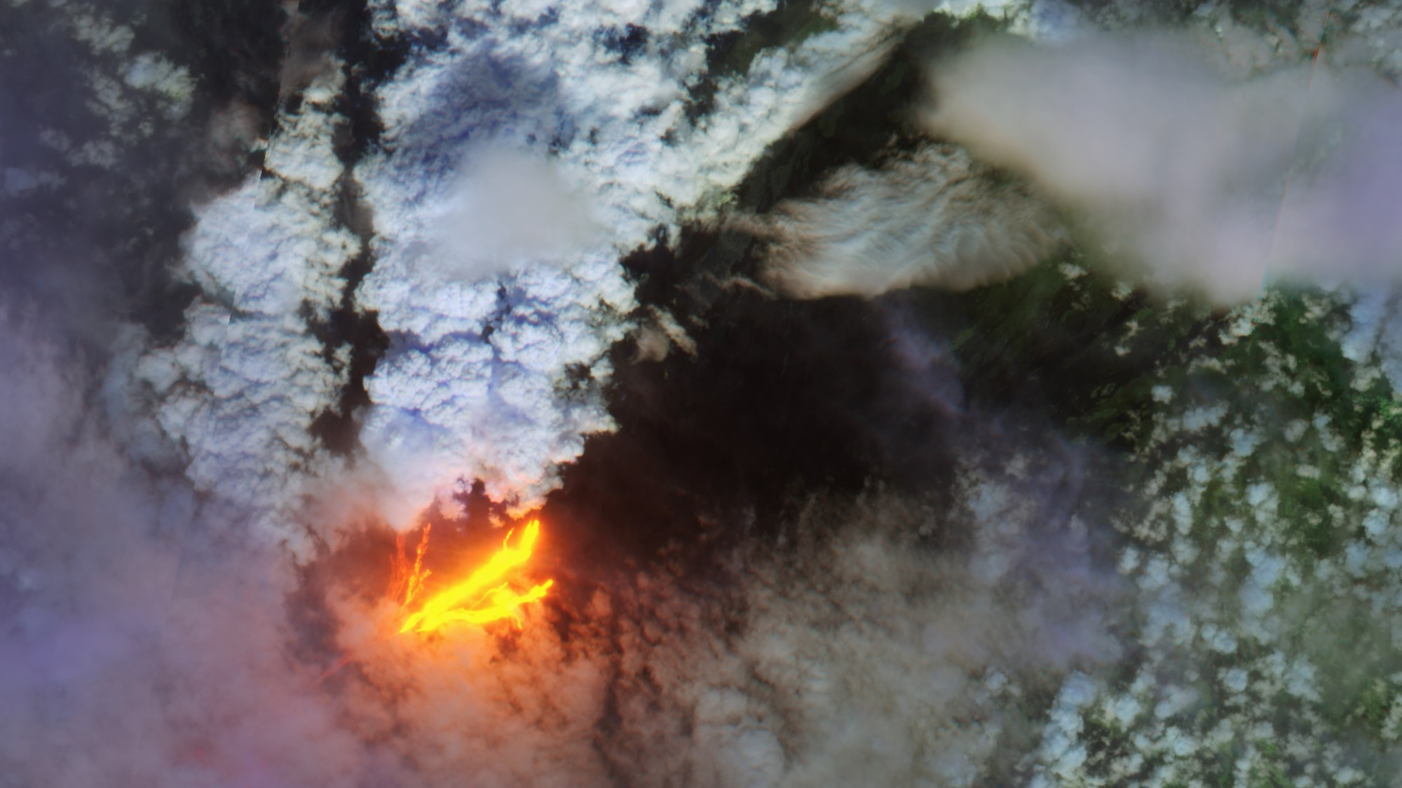 satellite photo of a volcano erupting, showing orange-hot lava and a plume of smoke