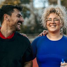 A happy man and woman laughing together. 