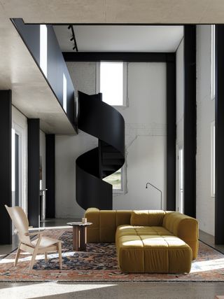 A spiral staircase brings a modern focal point to a historical space