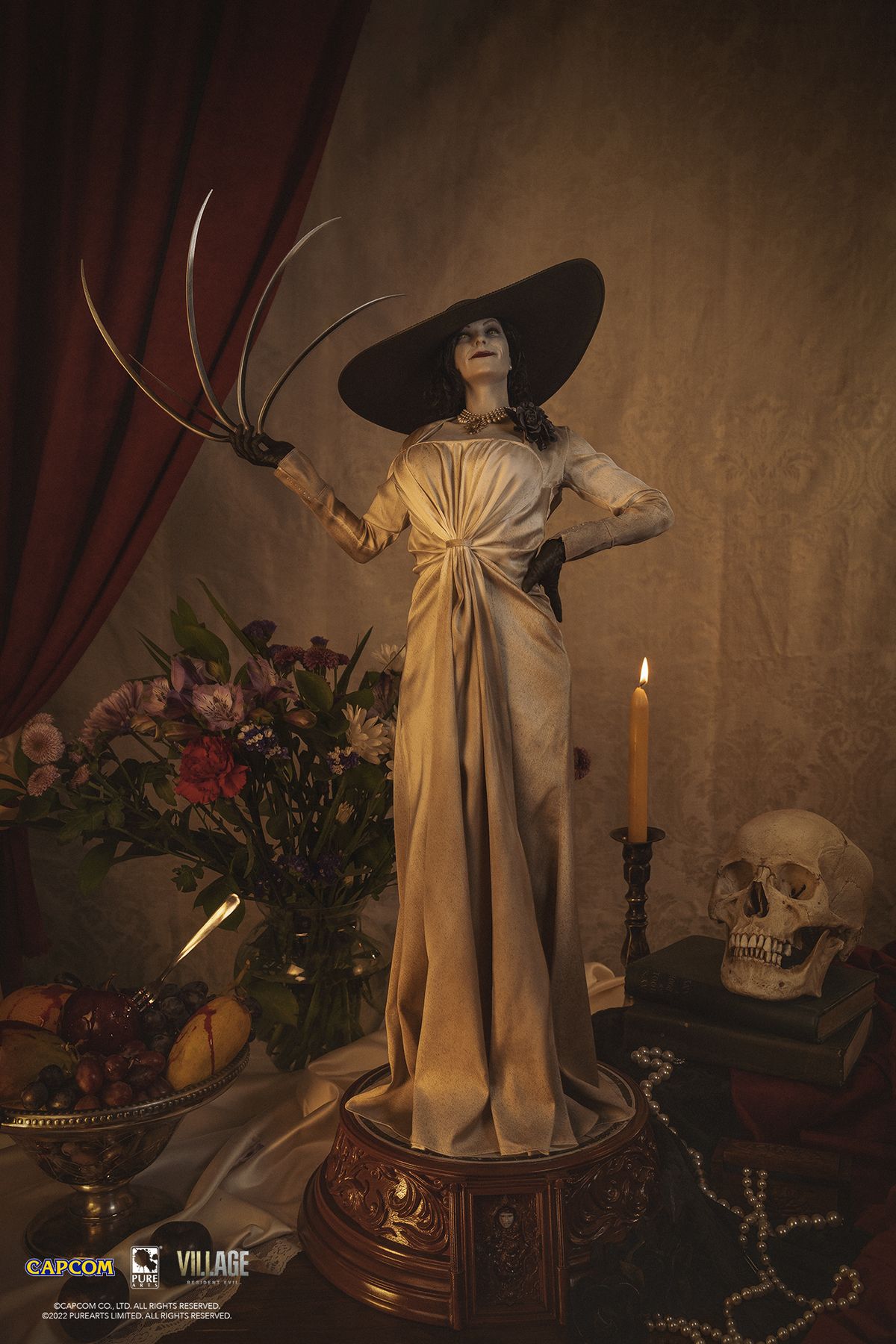 lady d statue center on view with candle and skull in background