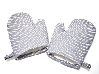 Grey oven mitts on a white background