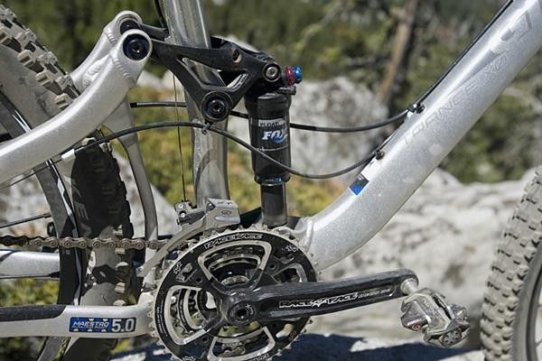 The rear shock placement is only slightly higher, minimizing the change in the center of gravity.